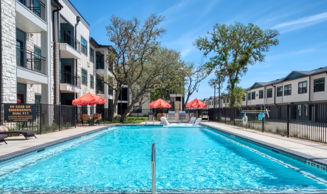 pool with red umbrellas